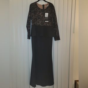 This is a breathtaking black dress with a top laced detail that is BRAND NEW!
